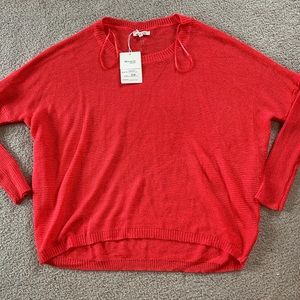 Dark neon pink dolman sleeve sweater.